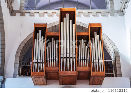 pipes of a church organ inside the interior of a Christian Catholic church. Cathedral of Sacred Heart of Jesus in Tashkent in Uzbekistan 116118312