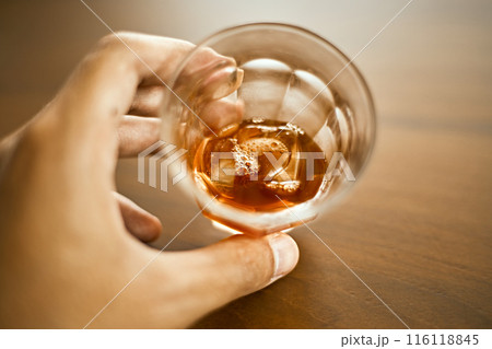 hands holding a mug of black coffee. hands holding a mug of black coffee. 116118845