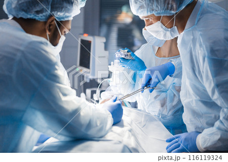 Surgeons perform a complex operation to save a human life at hospital Surgeons perform a complex operation to save a human life at hospital 116119324