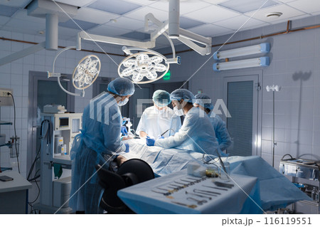 Team of Surgeons Operating in the Hospital 116119551