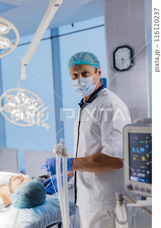 Medical Team Performing Surgical Operation in Bright Modern Operating Room 116120237
