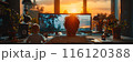 Man Working at Computer With Child During Sunset 116120388