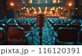 A Vintage Microphone on Stage Before a Live Audience 116120391