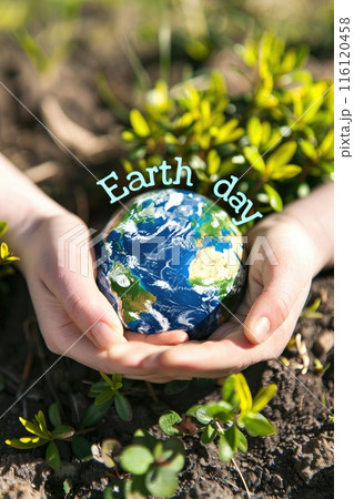 Hands Cradling Earth Globe on Greenery for Earth Day Hands Cradling Earth Globe on Greenery for Earth Day 116120458