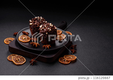 Delicious fresh muffins with filling and chocolate coating 116120887