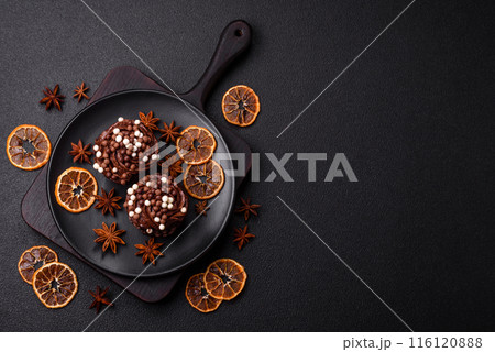 Delicious fresh muffins with filling and chocolate coating 116120888