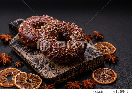 Delicious fresh donuts with filling and chocolate coating Delicious fresh donuts with filling and chocolate coating 116120907