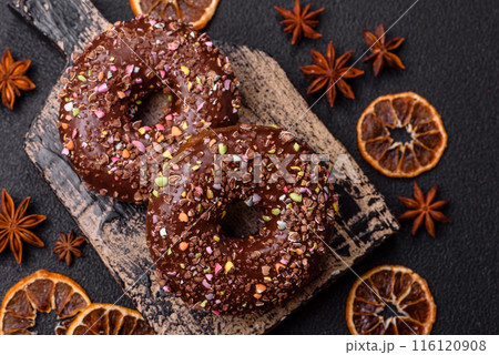 Delicious fresh donuts with filling and chocolate coating Delicious fresh donuts with filling and chocolate coating 116120908