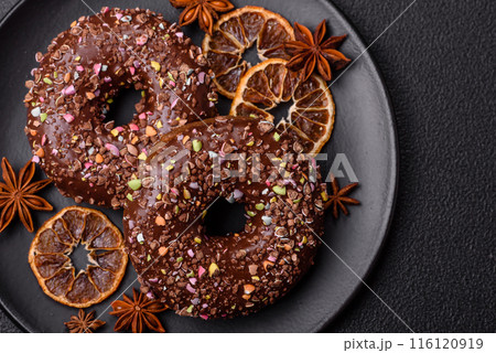Delicious fresh donuts with filling and chocolate coating Delicious fresh donuts with filling and chocolate coating 116120919