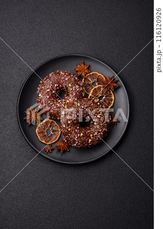 Delicious fresh donuts with filling and chocolate coating Delicious fresh donuts with filling and chocolate coating 116120926