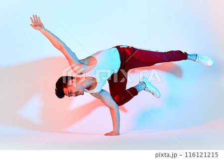 asian b-boy exercising in break dance on white background doing shoulder freeze 116121215