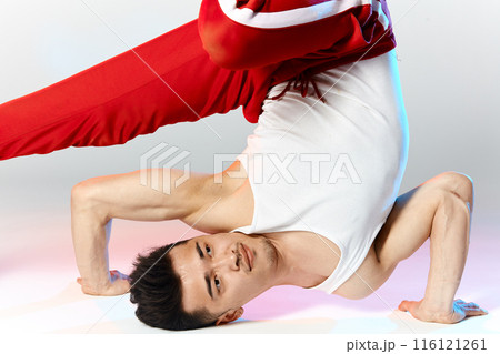 Hip hop male Korean break dancer dancing on white background Hip hop male Korean break dancer dancing on white background 116121261