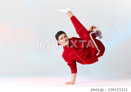 Asian personal break dancer trainer doing handstand on white background Asian personal break dancer trainer doing handstand on white background 116121311