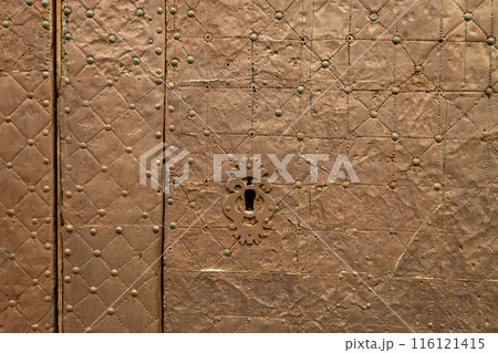 Old rusty door lock hole closeup. A keyhole in the old door. 116121415
