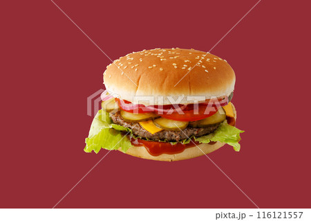 hamburger like in McDonald's with a beef cutlet on a red background, studio shooting 2 116121557