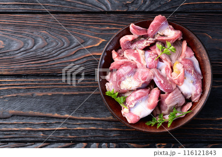 Raw chicken giblets gizzard ( stomach ) , meat background Raw chicken giblets gizzard ( stomach ) , meat background 116121843
