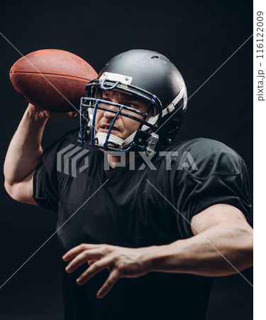Quarterback throwing a football in a professional football game Quarterback throwing a football in a professional football game 116122009