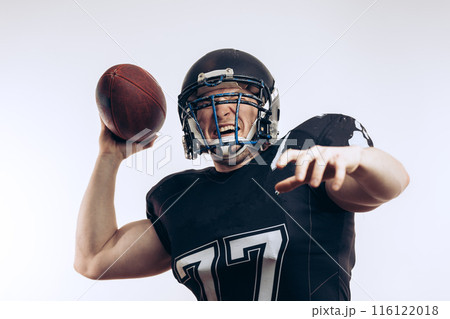 Quarterback throwing a football in a professional football game 116122018