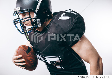 Quarterback throwing a football in a professional football game Quarterback throwing a football in a professional football game 116122134