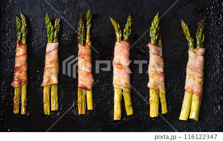 Fried asparagus rolled with bacon meat Fried asparagus rolled with bacon meat 116122347