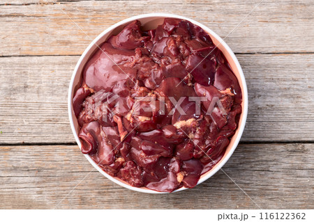Raw chicken giblets liver, meat background. 116122362