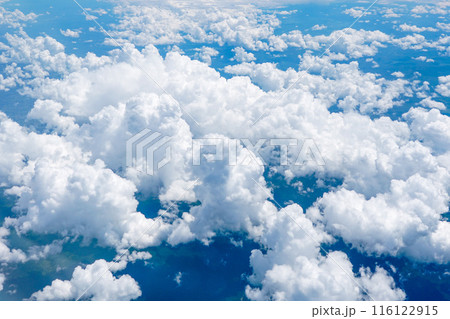 Landscape of beautiful fluffy puffy white cumulus clouds on blue sky background, top view 116122915