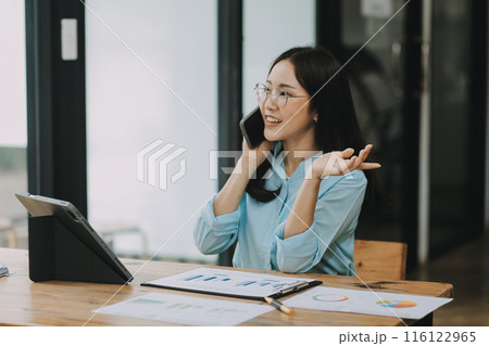 Asian woman working at the office. woman using laptop computer on desk at office Asian woman working at the office. woman using laptop computer on desk at office 116122965
