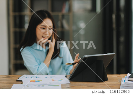 Asian woman working at the office. woman using laptop computer on desk at office 116122966