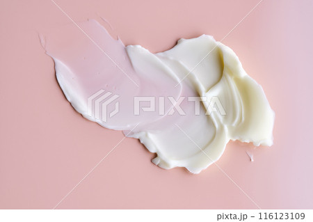 Texture of cosmetic butter on a pink background. Showcasing a thick and nourishing texture. 116123109