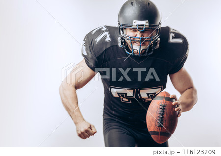 Quarterback throwing a football in a professional football game 116123209
