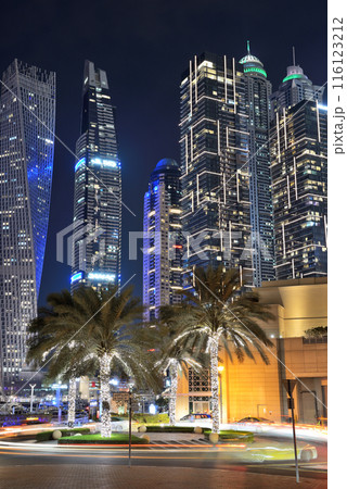 The night illumination of Dubai Marina and Cayan Tower, Dubai, UAE 116123212