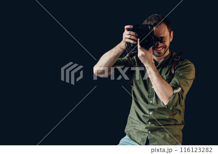 young guy enjoying taking photos 116123282