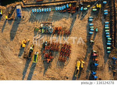 Aerial View of Multiple Rows of Tractors in a Georgia Field Aerial View of Multiple Rows of Tractors in a Georgia Field 116124278