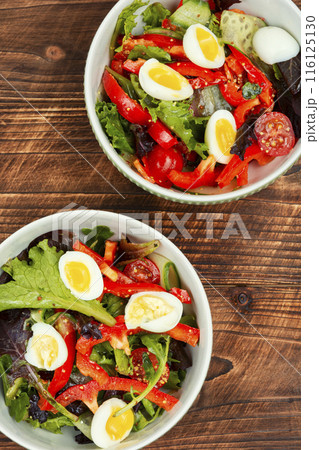 Summer salad with vegetables and eggs. Summer salad with vegetables and eggs. 116125130