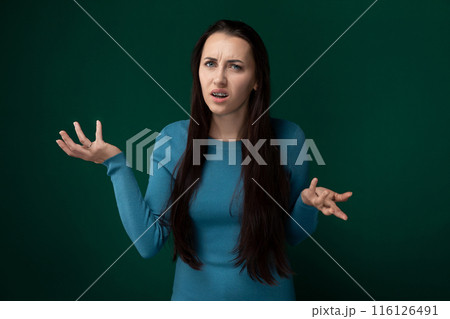 Woman in Blue Shirt Holding Out Her Hands Woman in Blue Shirt Holding Out Her Hands 116126491