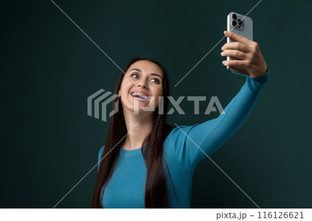 Woman Taking a Selfie With Her Cell Phone 116126621