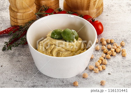 Tasty hummus with green olives Tasty hummus with green olives 116131441