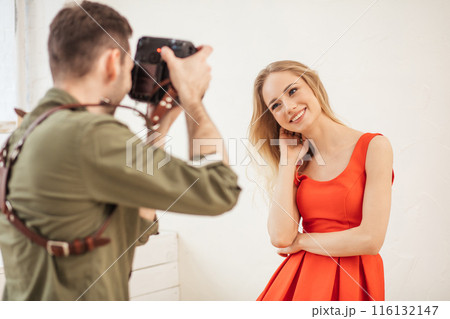 young photographer take photo for a newspaper young photographer take photo for a newspaper 116132147