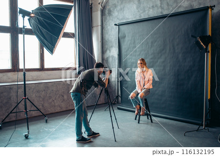 pleasant photographer making a client laugh 116132195