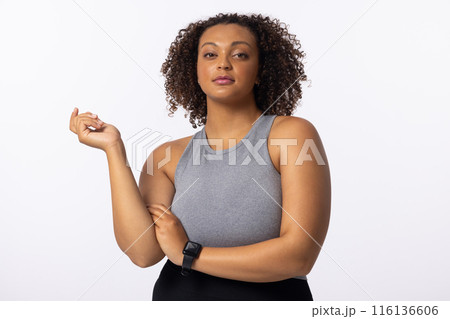 Biracial young female model poses on white background Biracial young female model poses on white background 116136606