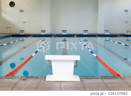 Swimmers are not present in the indoor pool with lanes marked for racing Swimmers are not present in the indoor pool with lanes marked for racing 116137062