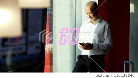 Image of 6g text over caucasian businessman using smartphone Image of 6g text over caucasian businessman using smartphone 116138846