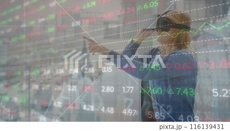 Image of financial data processing over caucasian woman using vr headset Image of financial data processing over caucasian woman using vr headset 116139431
