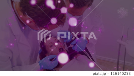 Image of molecules flowing over male dentist in face mask treating female patient in dentist chair 116140258