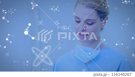 Image of molecules flowing over female doctor with face mask using digital tablet Image of molecules flowing over female doctor with face mask using digital tablet 116140267