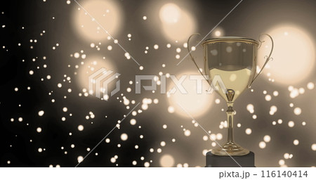 Image of a gloden cup over white shapes floating on black background with white lights Image of a gloden cup over white shapes floating on black background with white lights 116140414