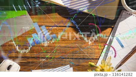 Digital composite image of financial data processing office equipment on office desk Digital composite image of financial data processing office equipment on office desk 116141282