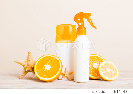 dispenser bottle and Citrus fruit in skincare product. beauty spa medical skincare and cosmetic lotion bottle cream product on table decor background with summer accessories 116141482