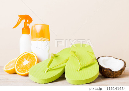 Top view composition of flip flops placed with beach accessories perspective view on table background. Tropical summer vacation concept Flat lay Top view composition of flip flops placed with beach accessories perspective view on table background. Tropical summer vacation concept Flat lay 116141484