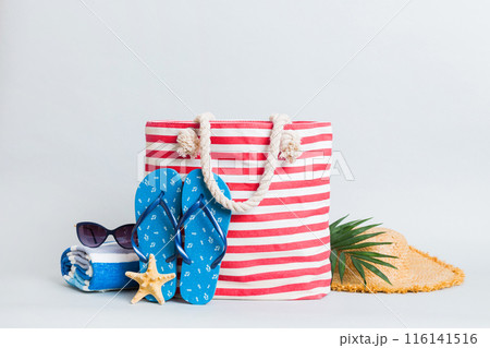 Stylish bag with beach accessories . Summer holiday concept. beach bag with straw hat with space for text 116141516